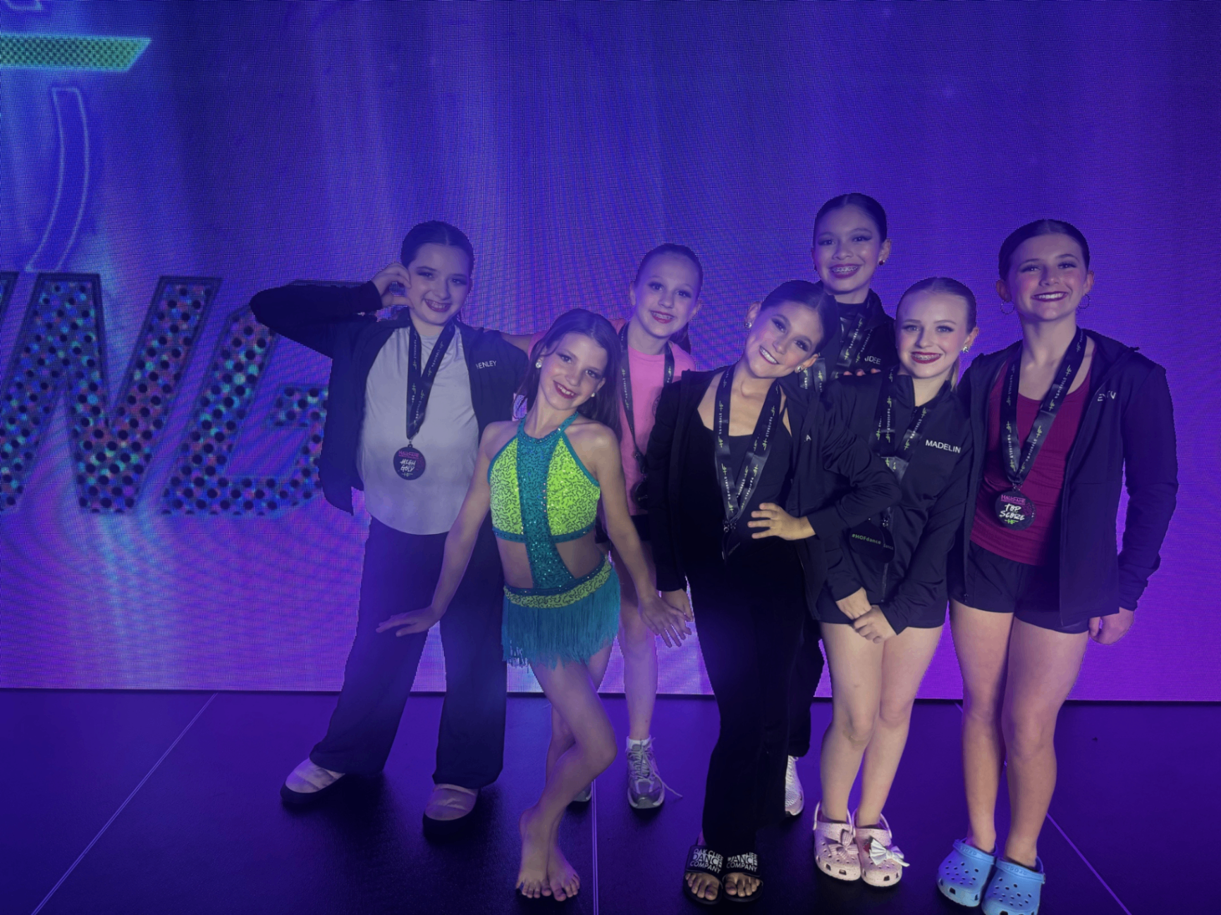Oak Cliff Dance Co. dancers on stage at a national competition